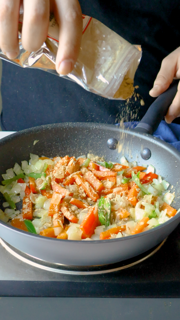 Add ginger and garlic and cook until fragrant, then stir in garam masala, cumin, turmeric and salt.